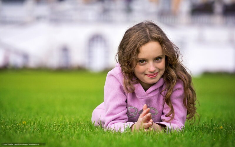 girl lying on grass