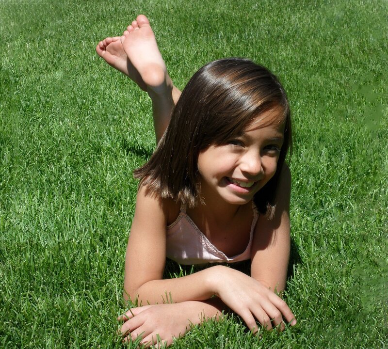 Girl Lying on Grass — Green, Happy