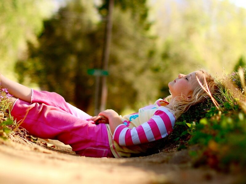 Girl Lying on Grass — Pink, Serene