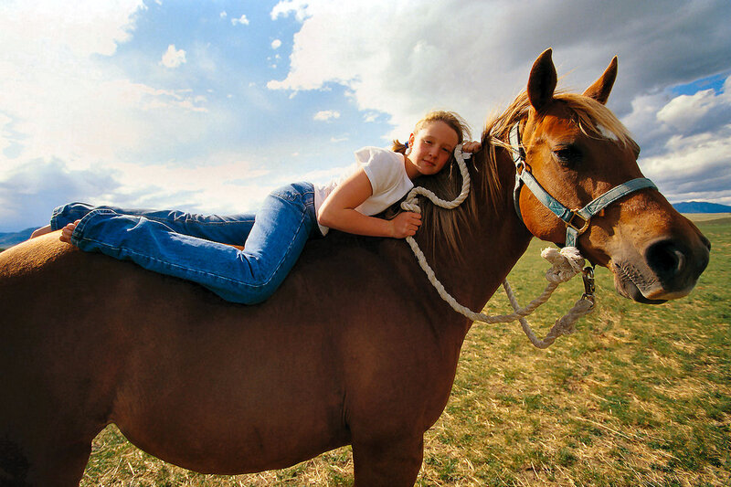 Girl Lying on Horse