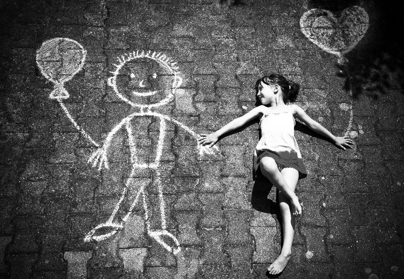 Girl Lying on Pavement