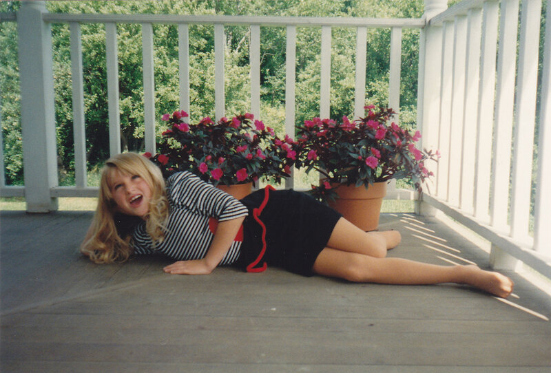 Girl Lying on Porch