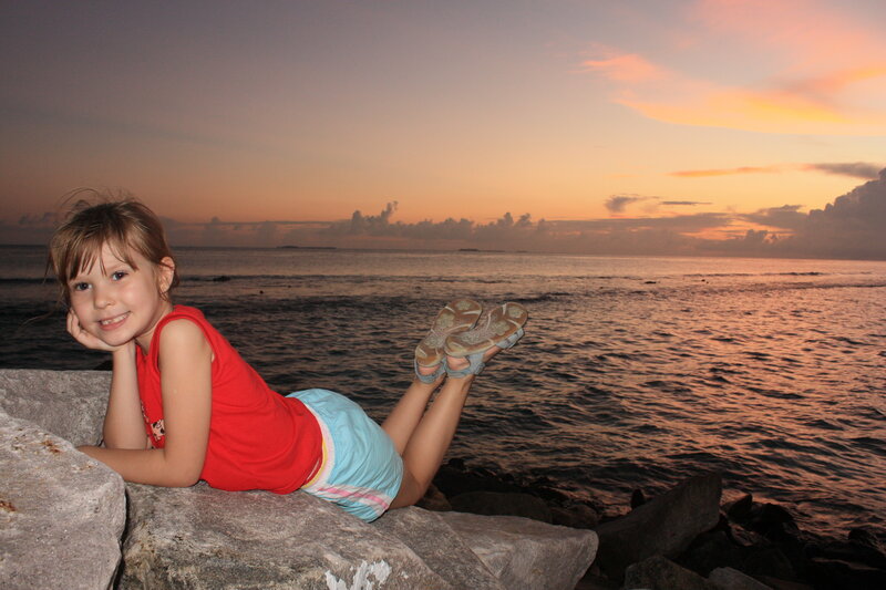 Girl Lying on Rocks — Orange