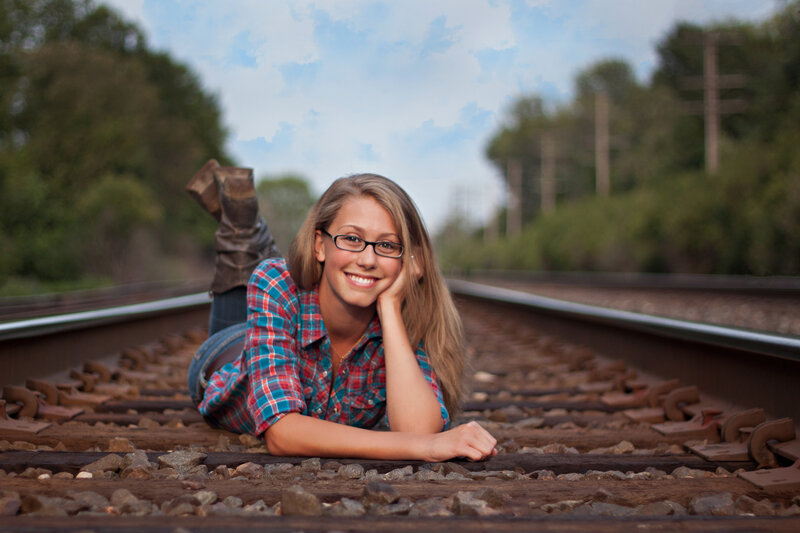 Girl Lying on Train Tracks