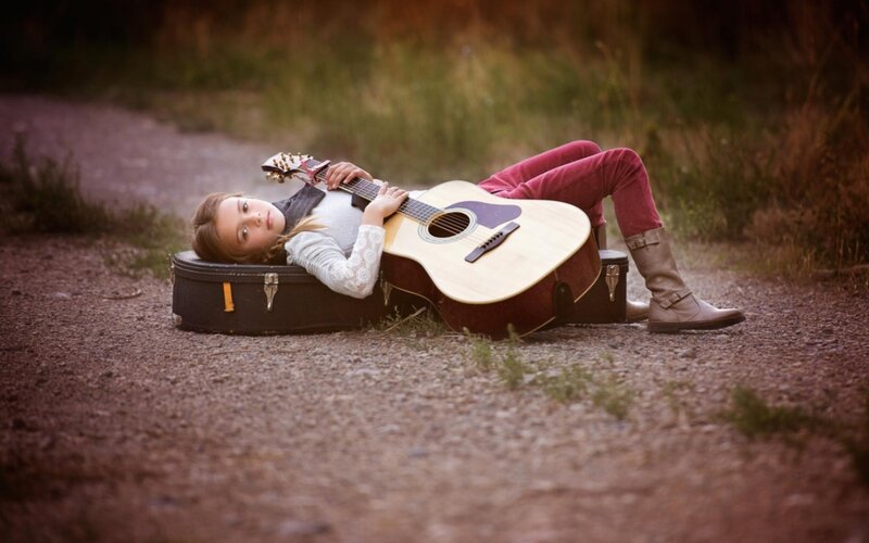 Girl Lying with Guitar