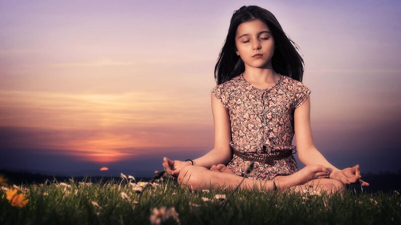 Girl Meditating in Field