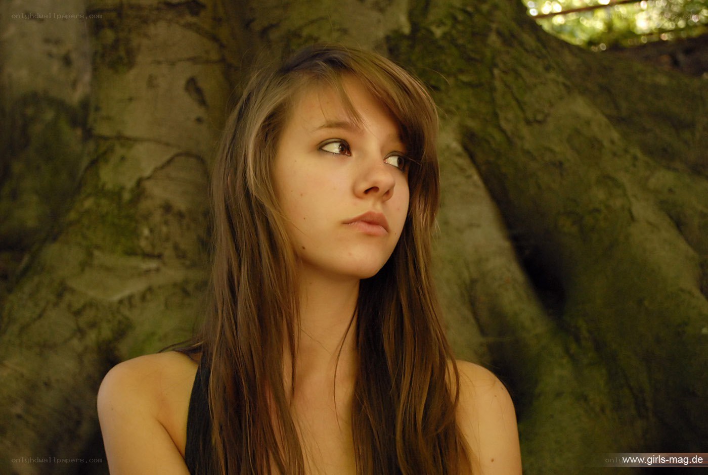 girl near tree trunk