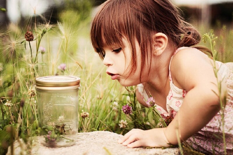 Girl Observing Insect