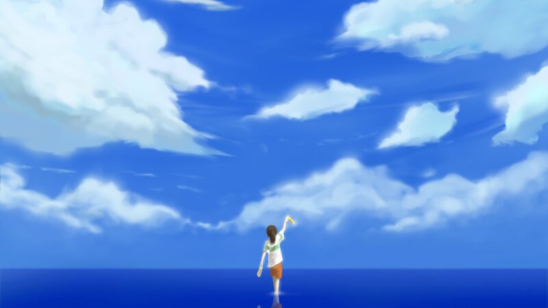 Girl on a beach under blue sky