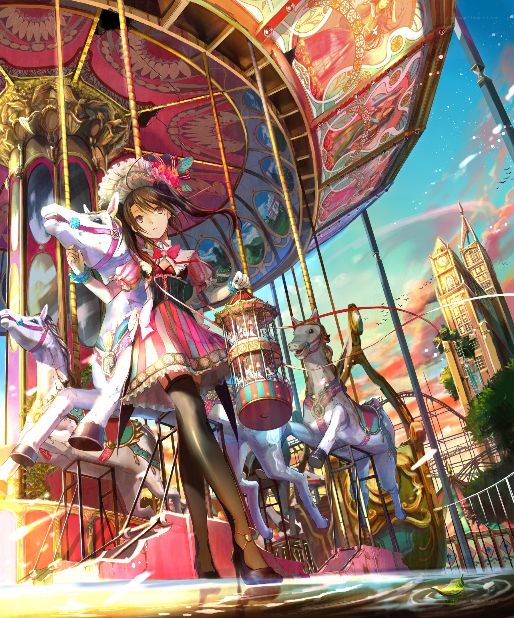 Girl on a carousel at sunset