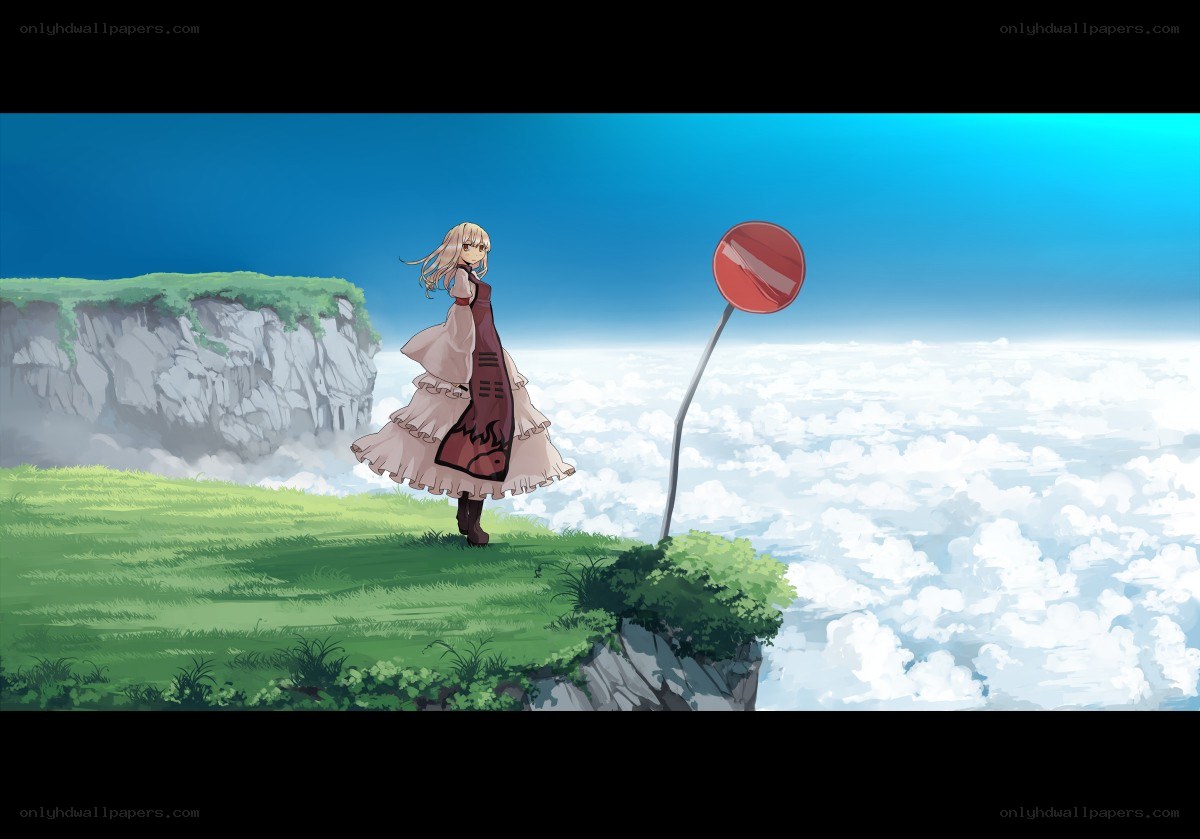 girl on a cliff above clouds