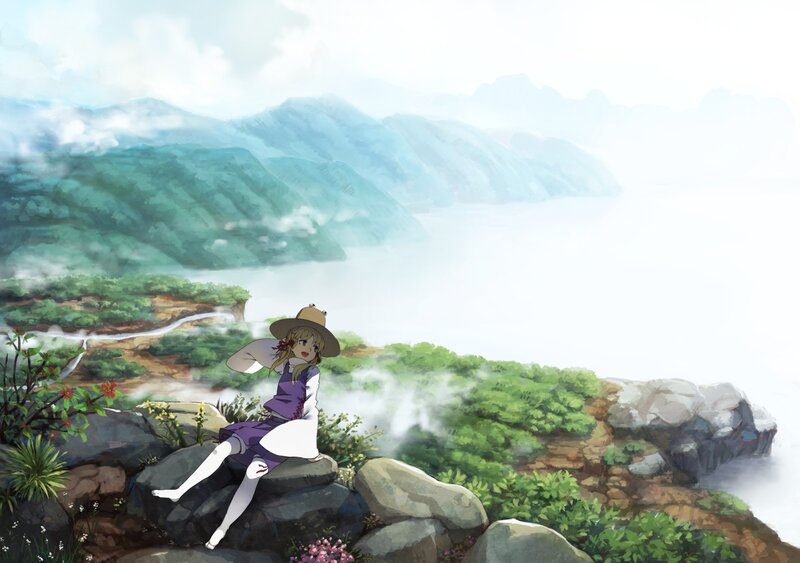Girl on a cliff overlooking mountains