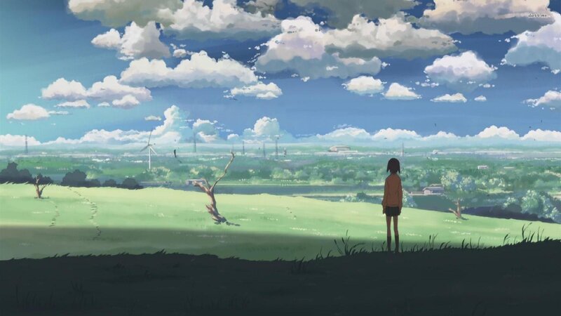 Girl on a hill overlooking the valley