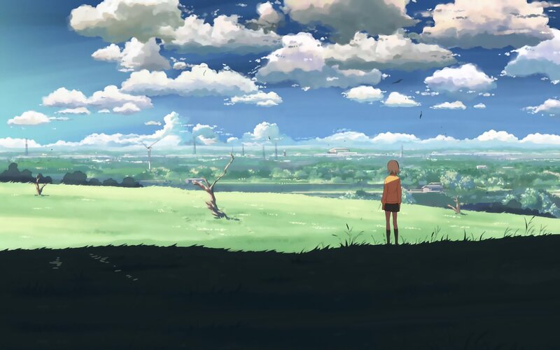 girl on a hill overlooking the valley