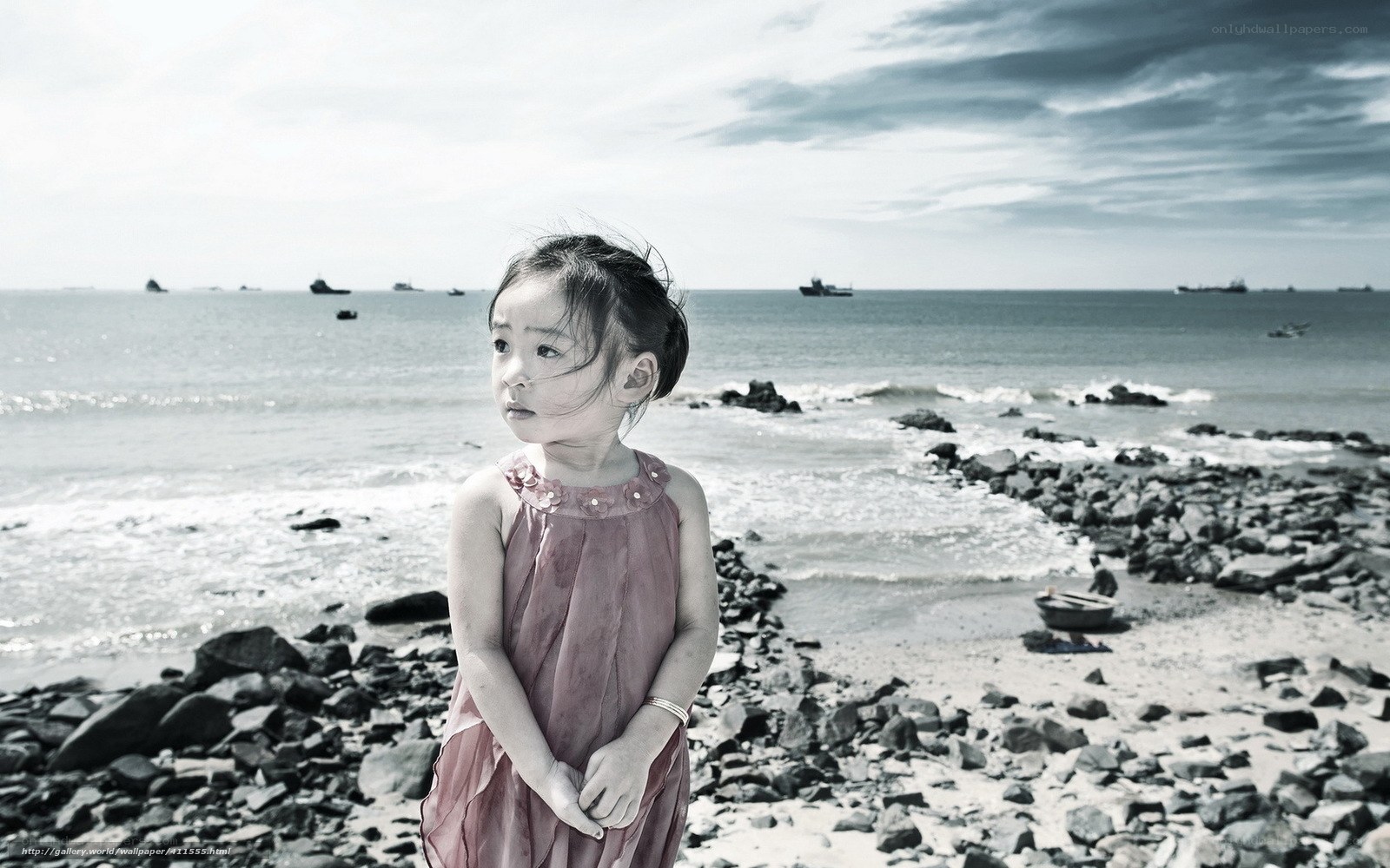 Girl on a rocky beach