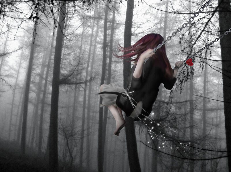 Girl on a swing in the forest