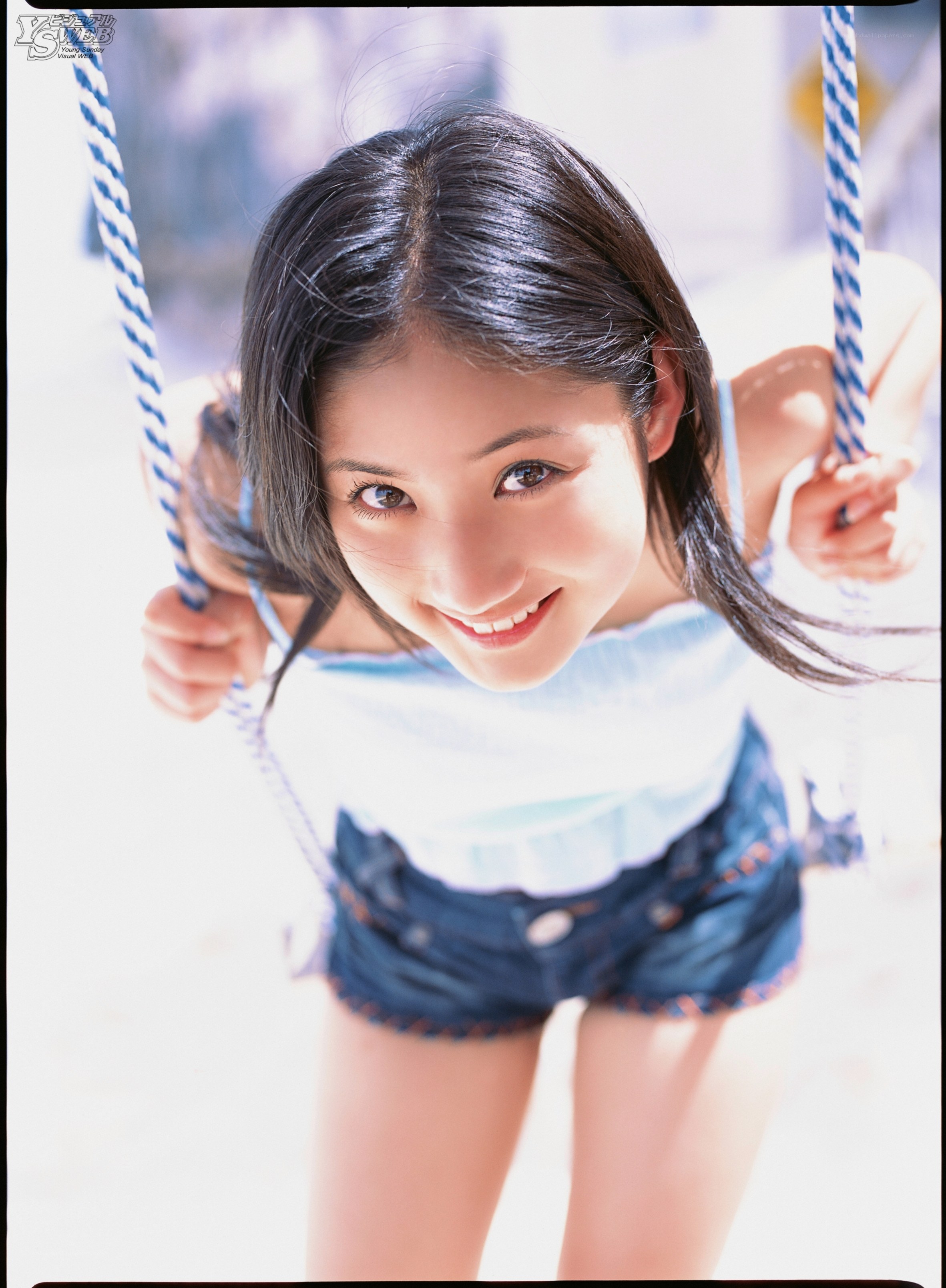Girl on a swing smiling