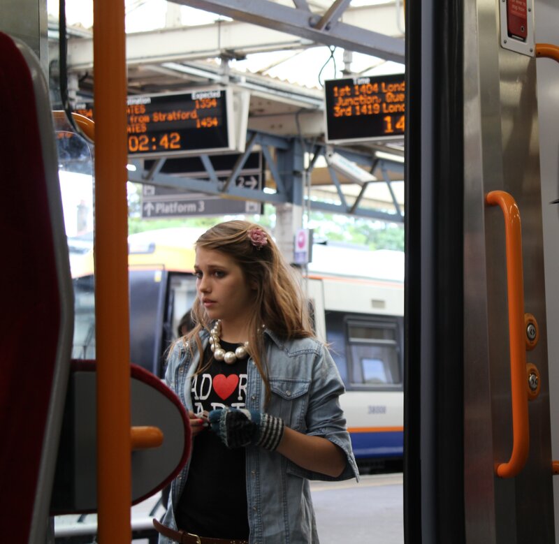 Girl on a train at the station