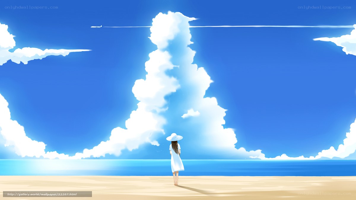 Girl on beach under blue sky