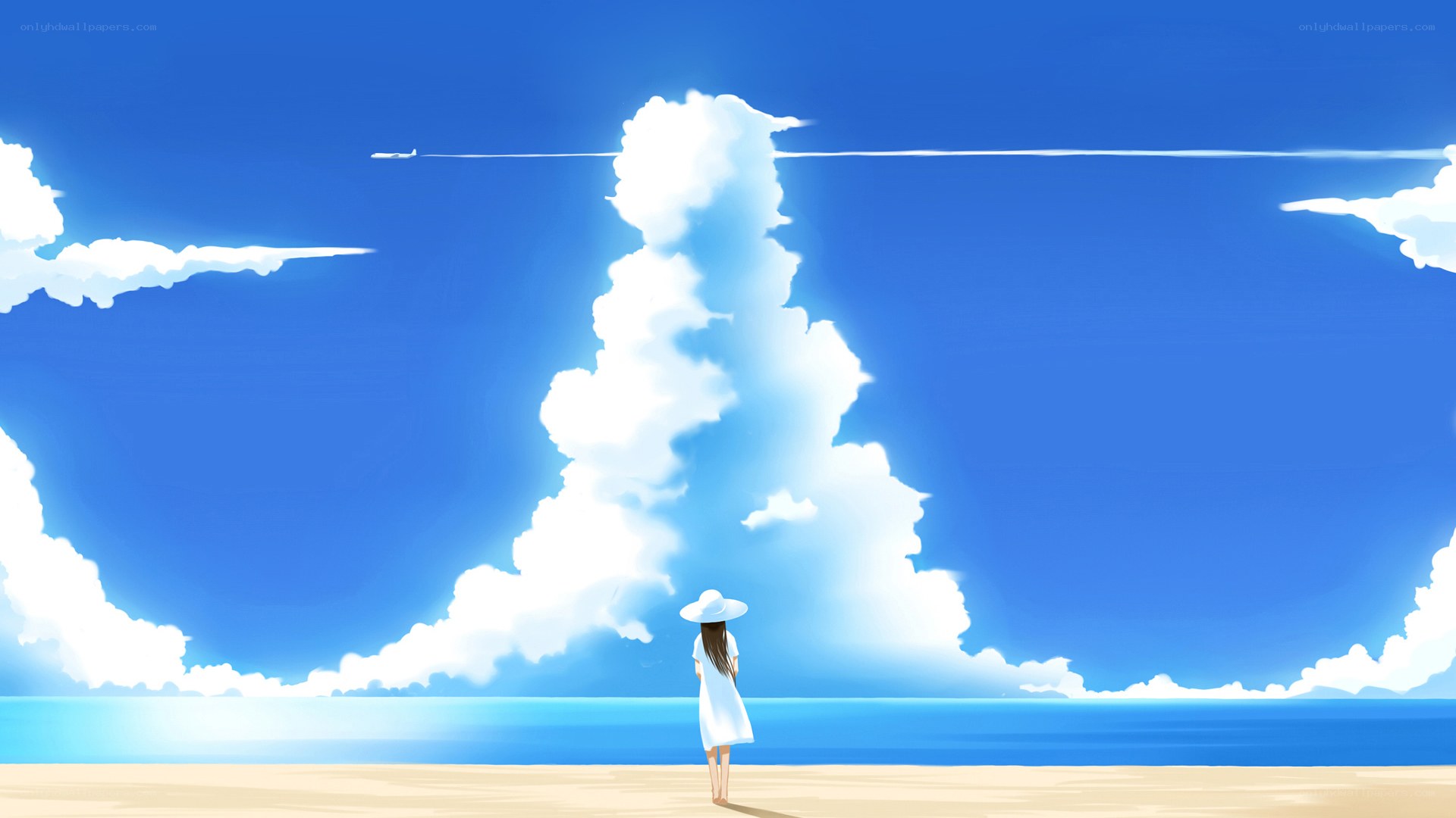 Girl on beach watching clouds