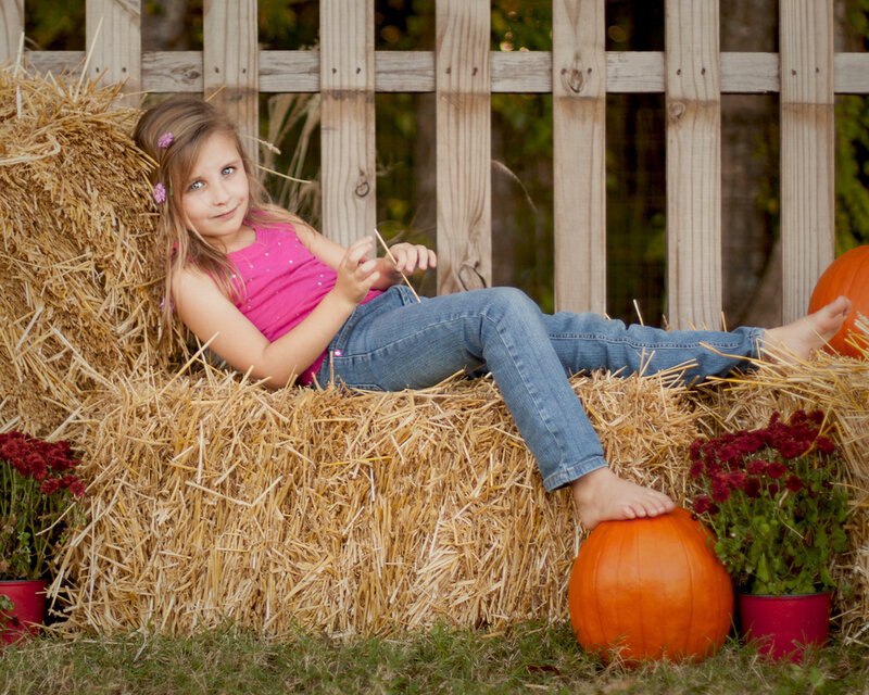 Girl on Hay Bale — Orange