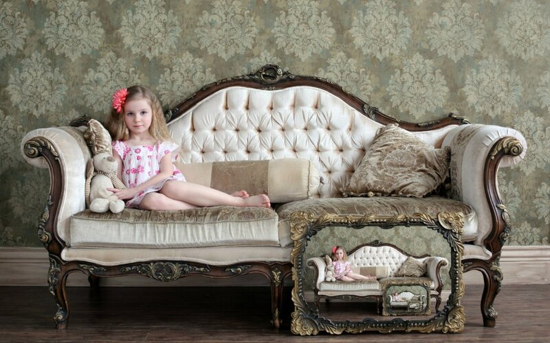 Girl on Ornate Sofa