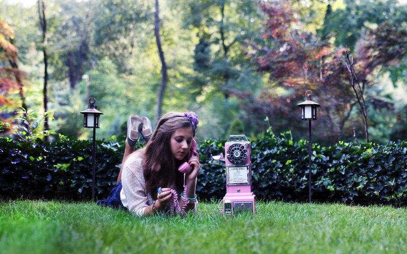 Girl on phone in garden