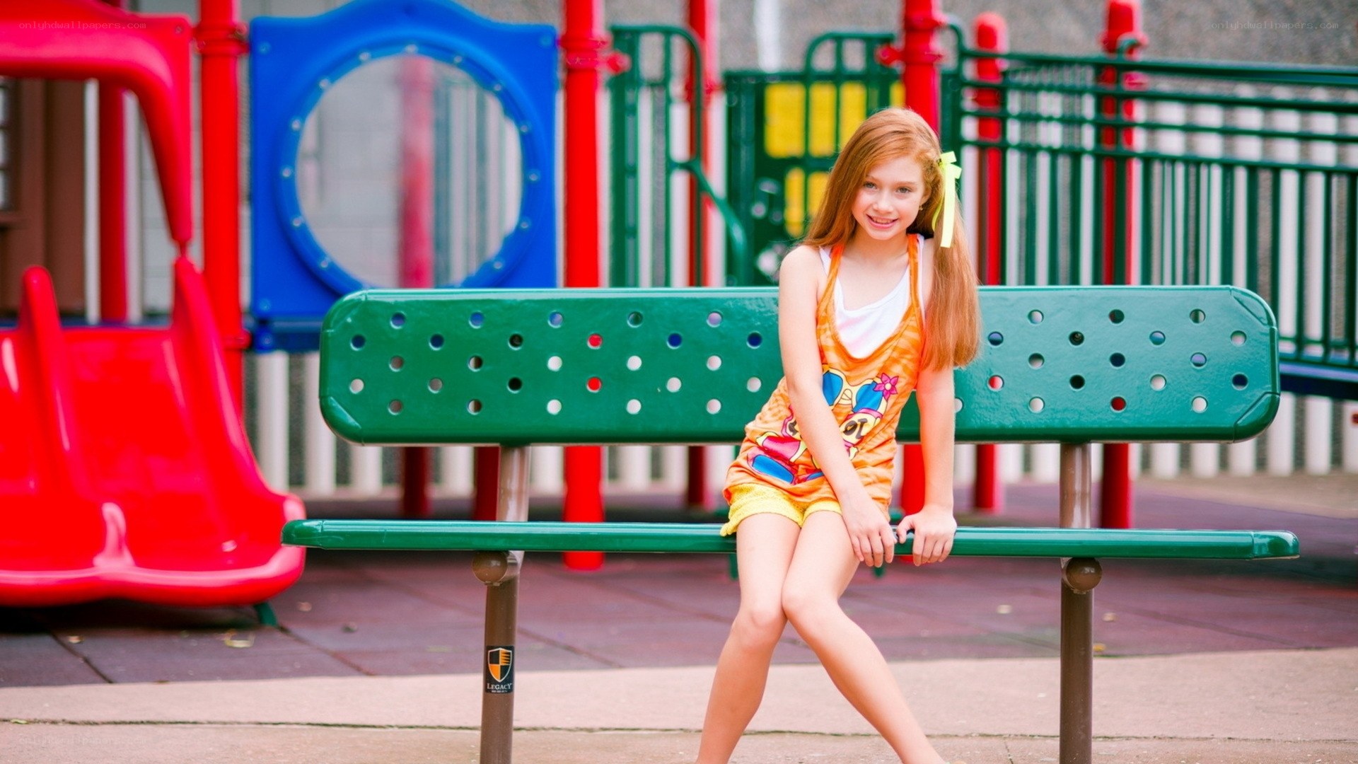 Girl on playground bench