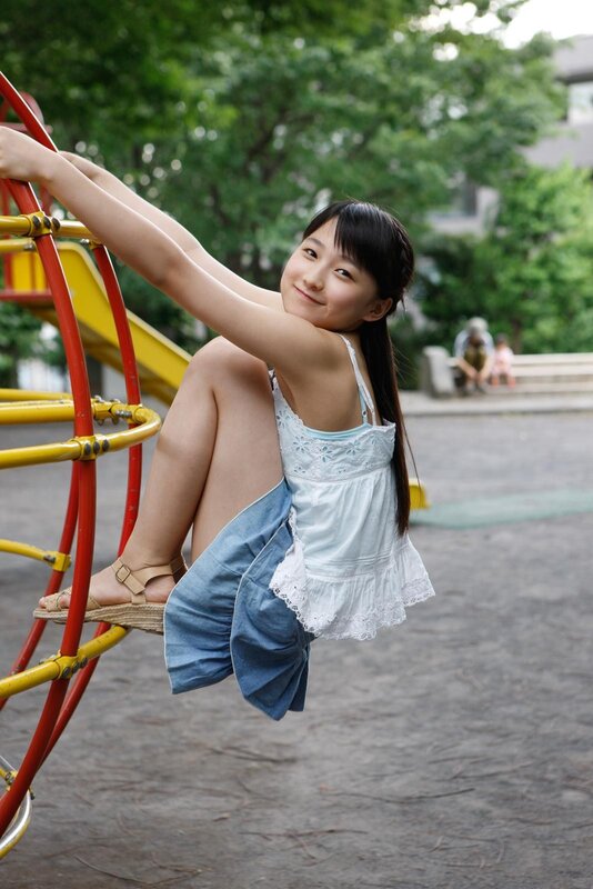 Girl on playground equipment