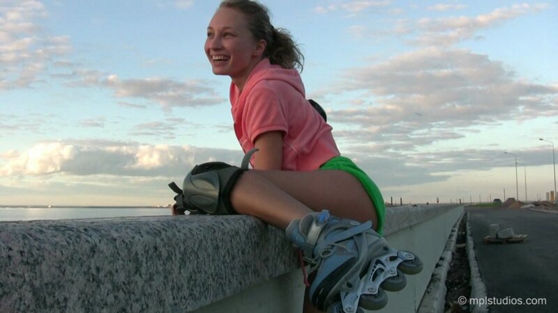 Girl on roller skates by the water