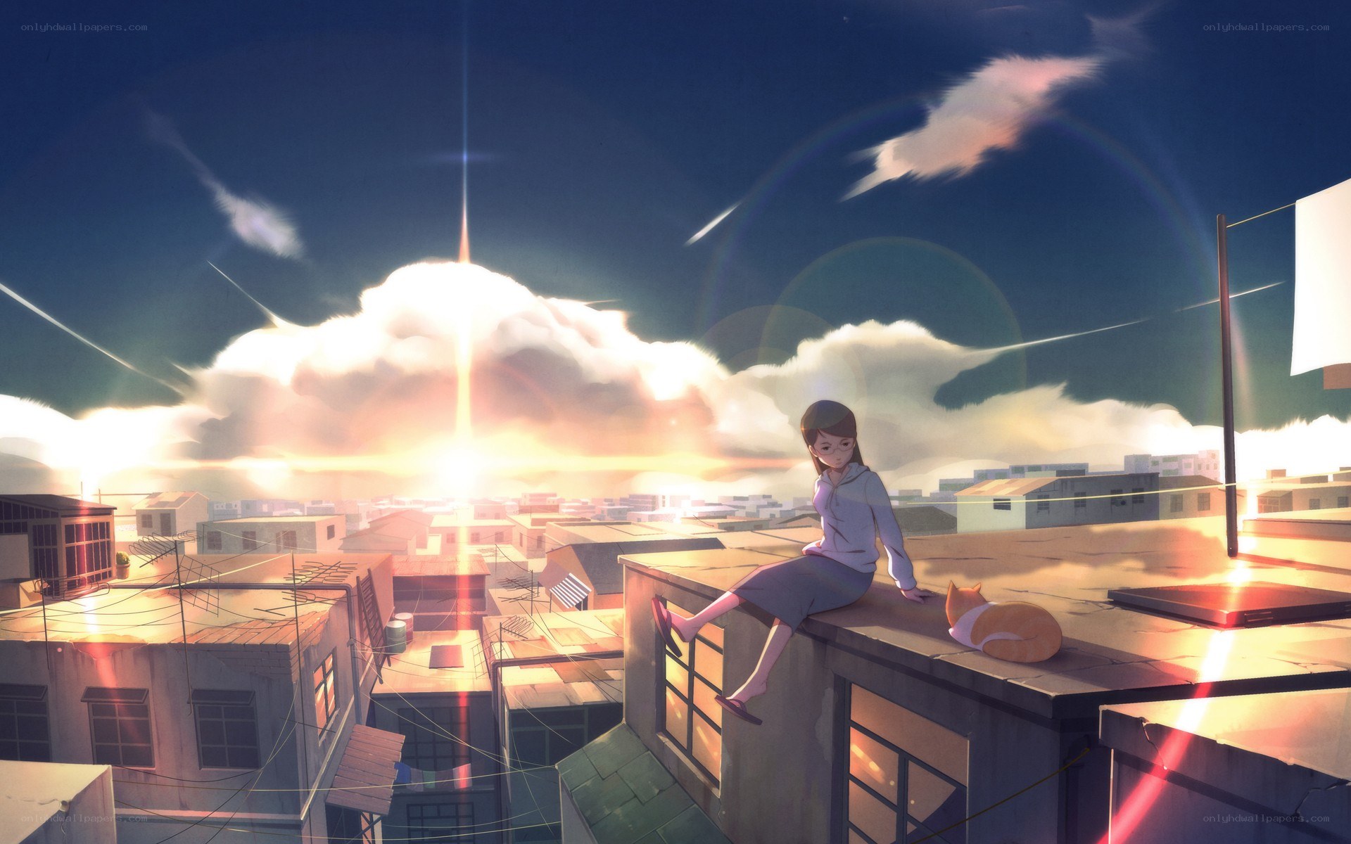 Girl on rooftop at sunset