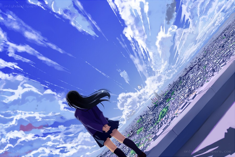 girl on rooftop overlooking city