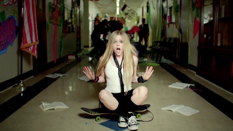 Girl on skateboard in school hallway