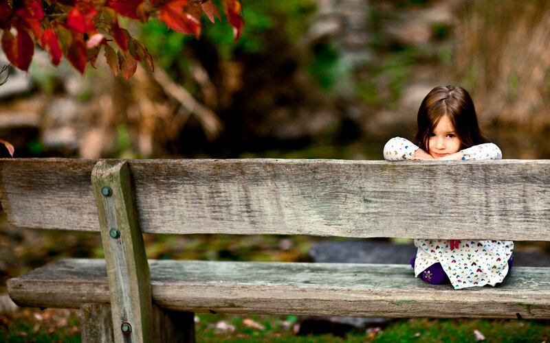 Girl on Wooden Bench