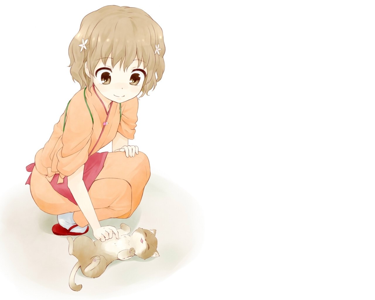 girl petting a kitten