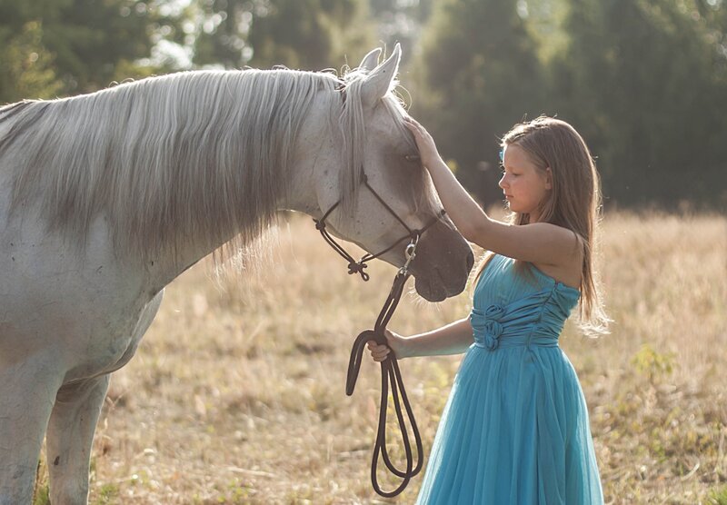 Girl Petting White Horse
