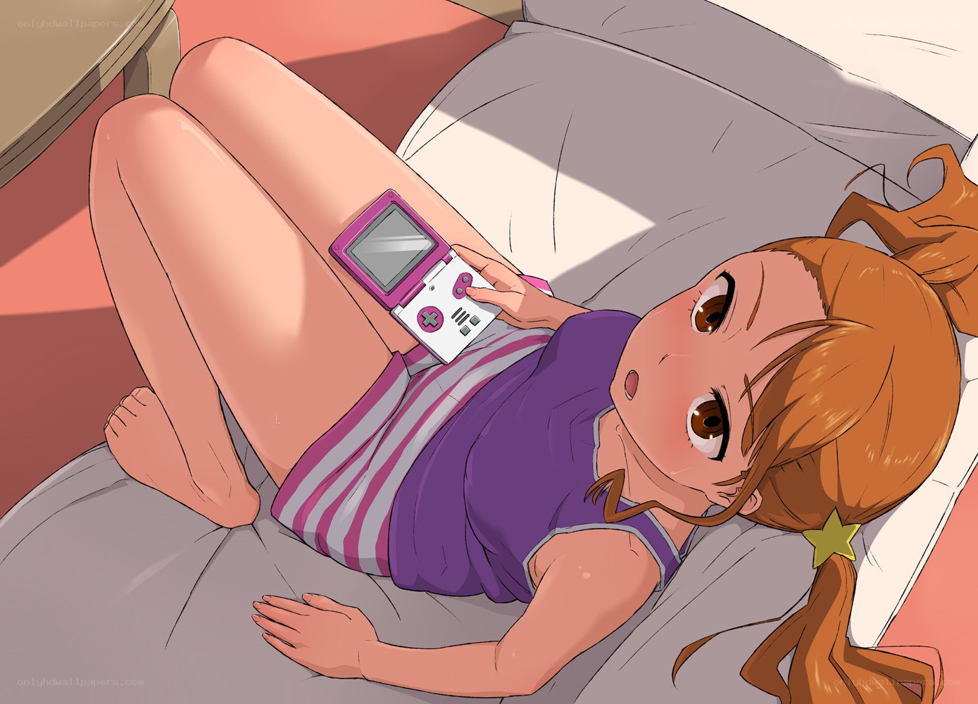 girl playing game on bed