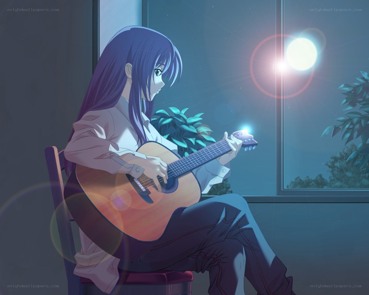 Girl playing guitar by window
