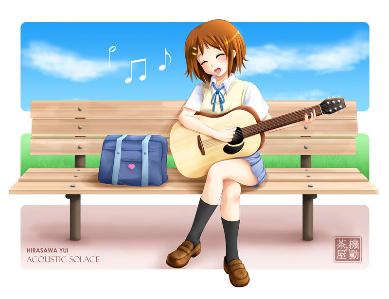 Girl playing guitar on bench