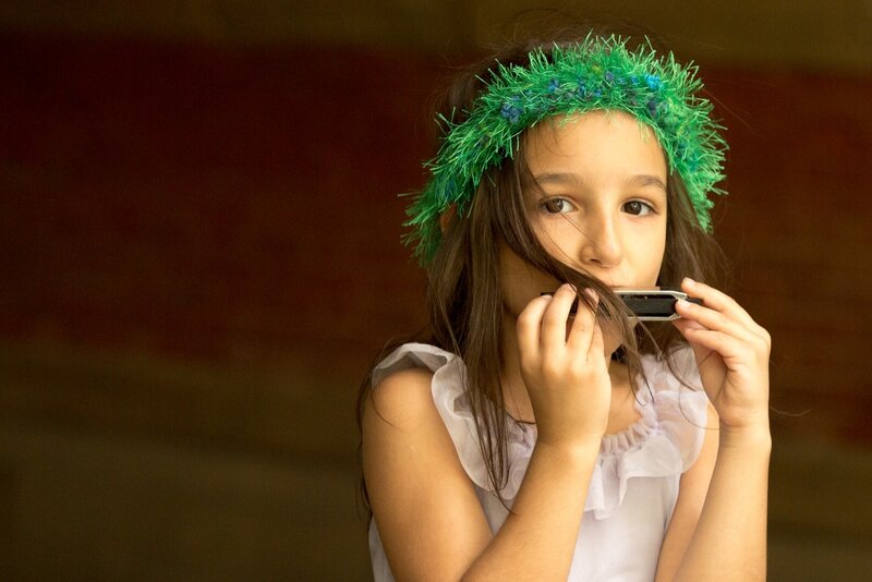Girl Playing Harmonica