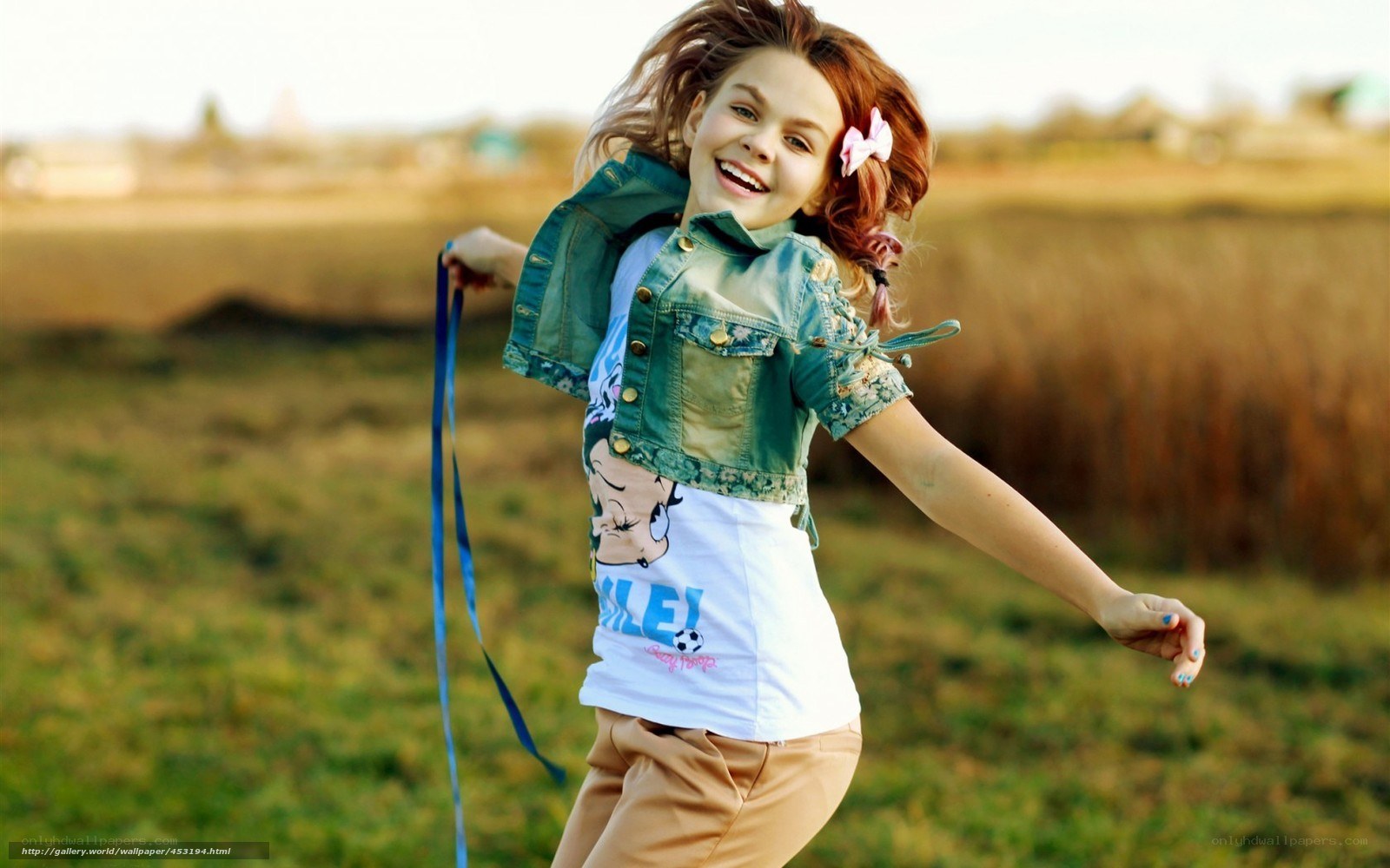 girl playing in a field