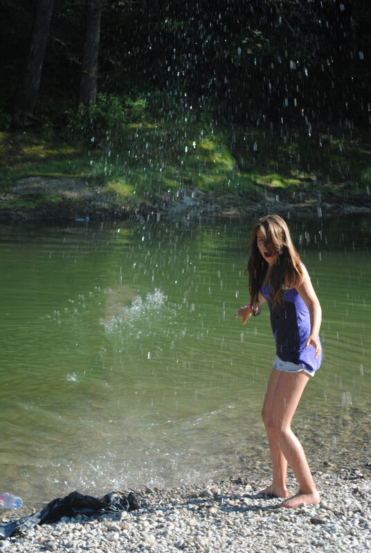girl playing in river water