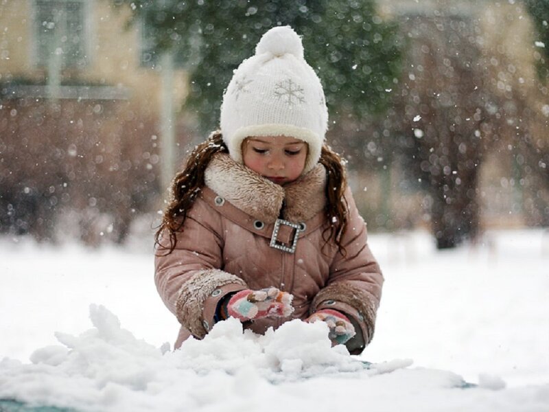 Girl Playing in Snow