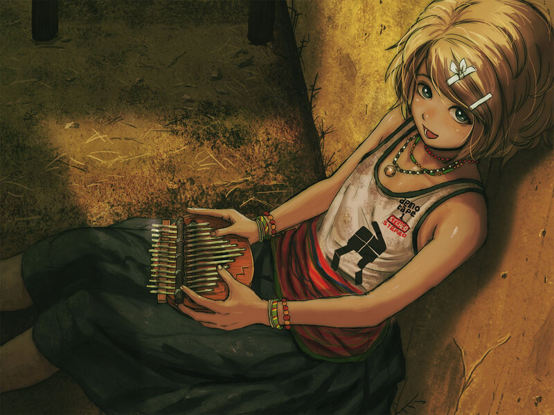 Girl playing kalimba in a barn
