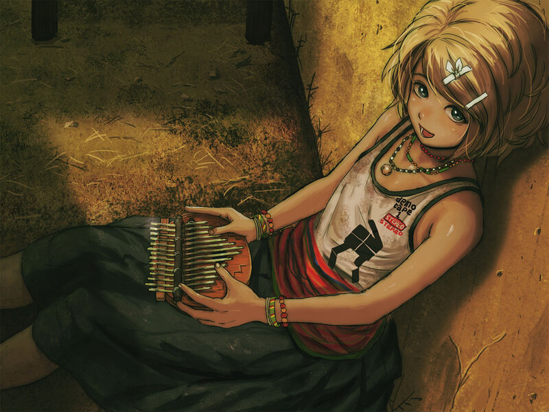 girl playing kalimba instrument
