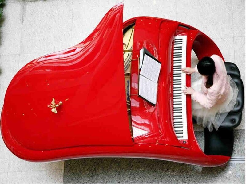 Girl Playing Red Piano