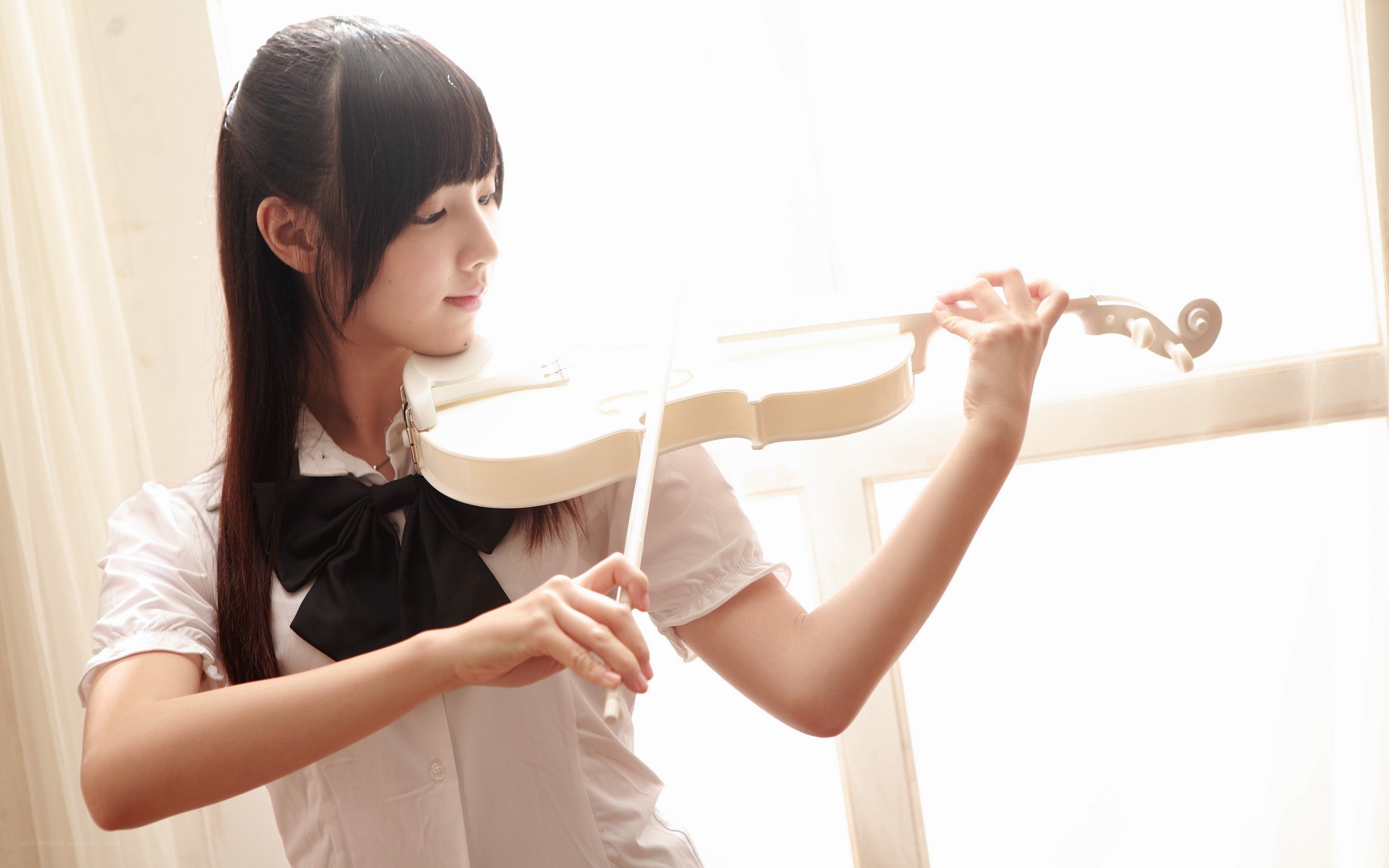 Girl playing white violin