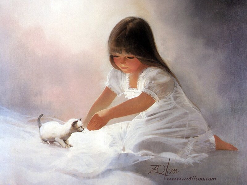Girl playing with a kitten