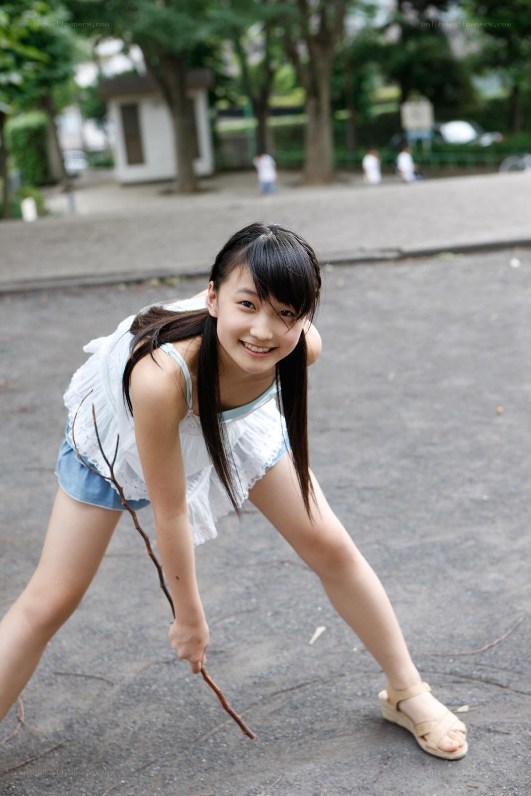 Girl playing with a stick