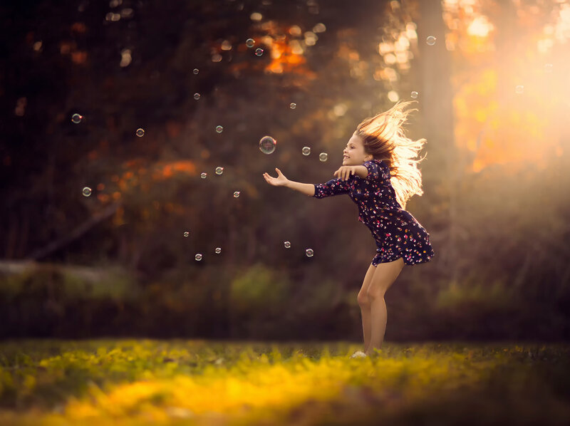 Girl Playing with Bubbles